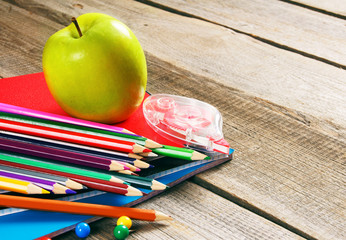 School tools. On wooden background.