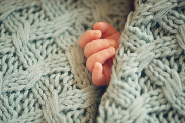 Small delicate little hand of newborn