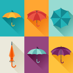 Fototapeta premium Set of cute multicolor umbrellas in flat design style.