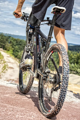 Obraz na płótnie Canvas Handicapped mountain bike rider before downhill ride