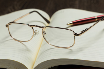 Notepad and glasses