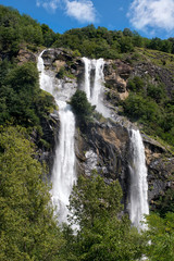 Twin waterfall cascading down a mountainside