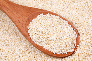 Sesame seeds in a wooden spoon