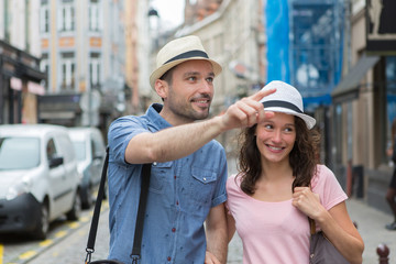 Young couple visiting city during holidays