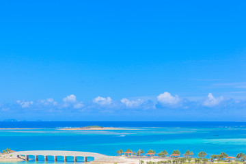 Fototapeta na wymiar Tropical white sand beach and blue sky