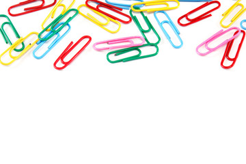 Colored paper clips on white background.