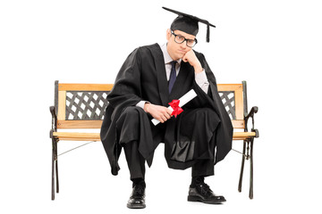 Angry college graduate holding a diploma