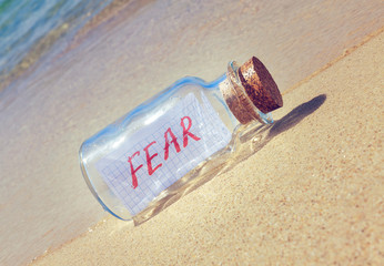 Creative anxiety and fear concept. Bottle with a message - obrazy, fototapety, plakaty