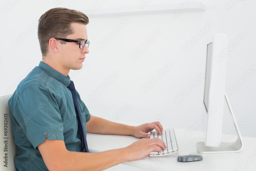 Poster casual businessman working at desk with computer