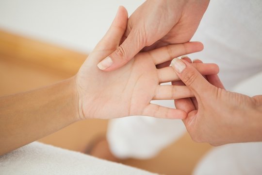 Woman receiving a hand massage