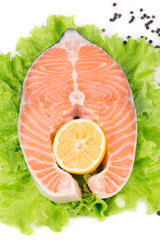 Fresh salmon steak with pepper and lemon.