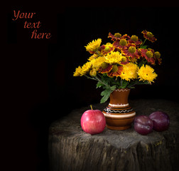 Nosegay of chrysanthemums and Gayllardiyas with ripe fruits