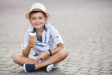Happy baby boy eating ice cream