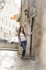Fototapeta na wymiar beautiful girl posing in a historic street