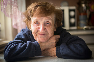 Close-up portrait of an elderly woman in her home.