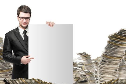 business and money concept - young businessman with money growth