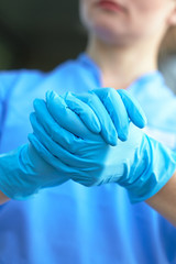 woman doctor in medical gloves
