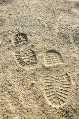Schuhabdrücke im Sand