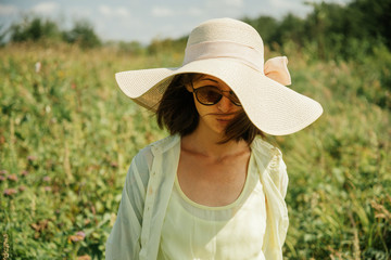 Beautiful woman on nature in summer