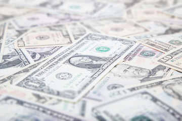 Dollar notes background concept. Tilt/Shift blurred out