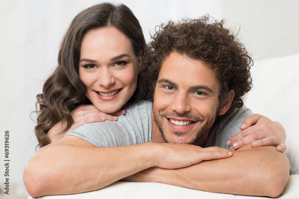 Wall mural young couple embracing