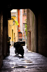 Mail delivery at typical backstreet at downtown of Ferrara