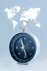 Compass on the world map background.