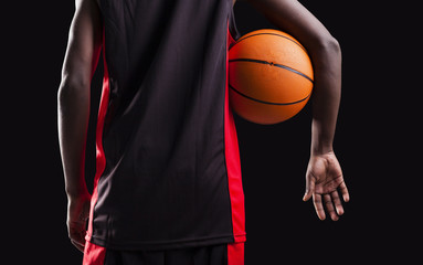 Rear view of a basketball player standing with a basket ball on © cristovao31