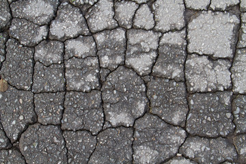 Cracks in eroded asphalt