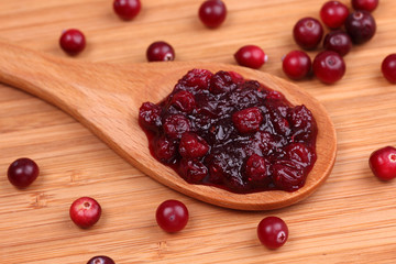 Cranberry sauce in a wooden spoon