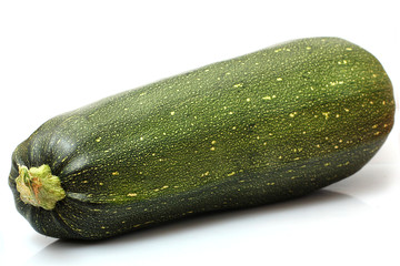 one fresh zucchini on a white background