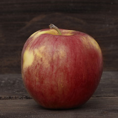 fresh organic apple on wooden table