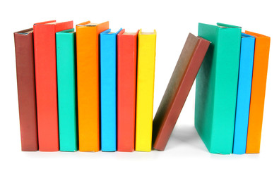 Multi-coloured books. On white background.