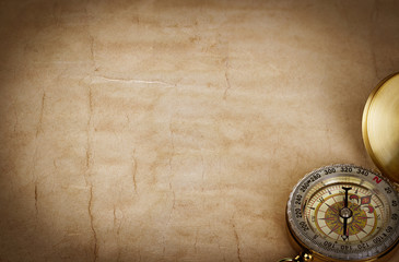 Compass on vintage old paper background