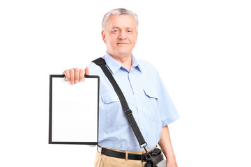 Mature mailman holding a clipboard