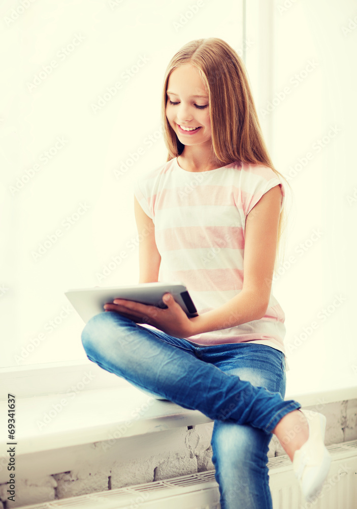 Wall mural girl with tablet pc at school