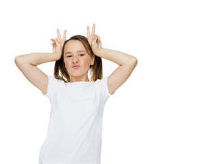 Young girl making a horns gesture