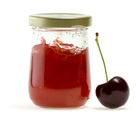 Jam in bottle and one of nectarine on white background.