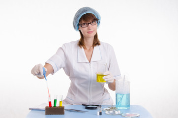 Chemist gaining liquid from a test tube