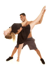couple dancing man no shirt holding woman leg up