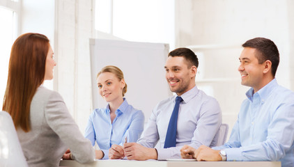 smiling businesswoman at interview in office