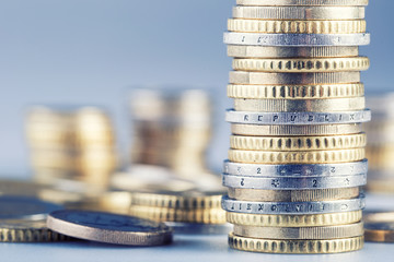 Euro coins on pile of other coins in background.Macro
