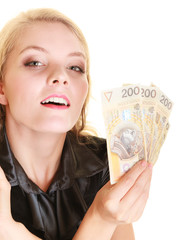 Happy woman holding polish currency money banknote.