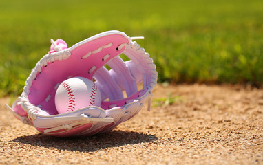 Baseball in Pink Female Glove on Field