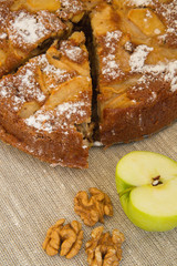 Homemade apple pie, a piece of apple and nuts