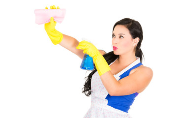 Beautiful young girl wearing apron and gloves cleaning