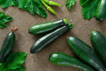 Fresh organic zucchini on the wooden table