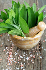 sage in mortar on wooden surface