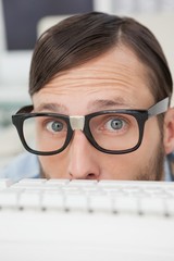 Nerdy businessman working on computer