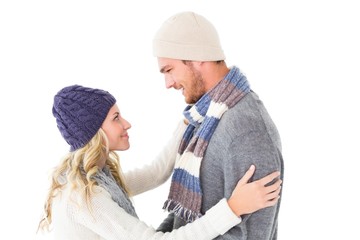 Attractive couple in winter fashion hugging